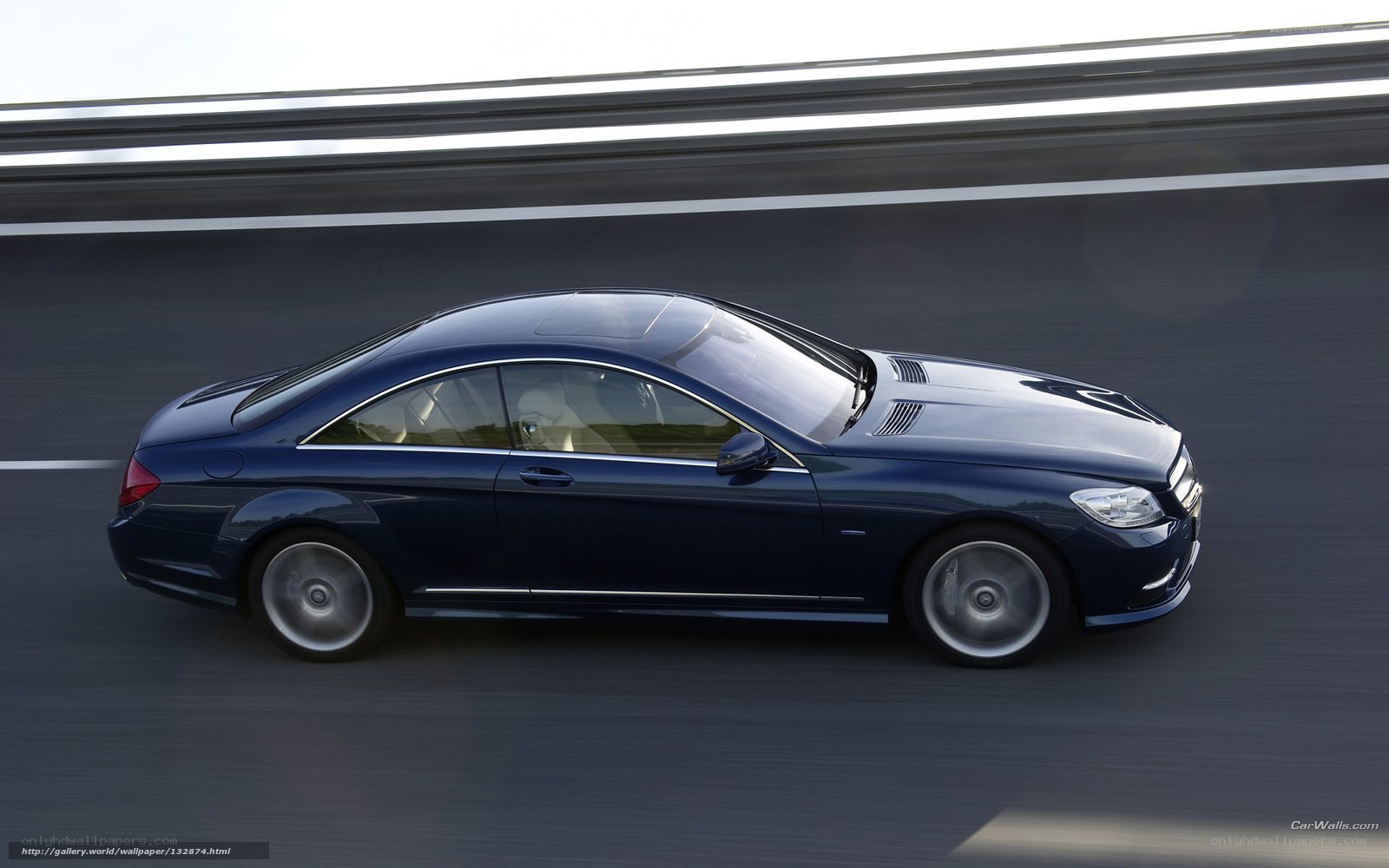 blue mercedes-benz coupe in motion
