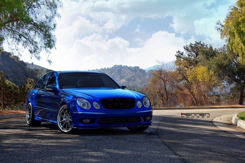 Blue Mercedes-Benz on a scenic road