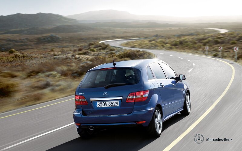 Blue Mercedes-Benz on a winding road