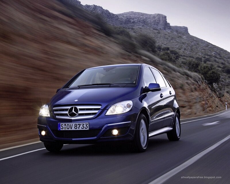 blue mercedes-benz on mountain road