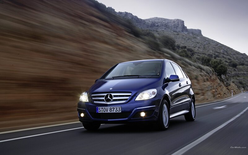 Blue Mercedes-Benz on mountain road