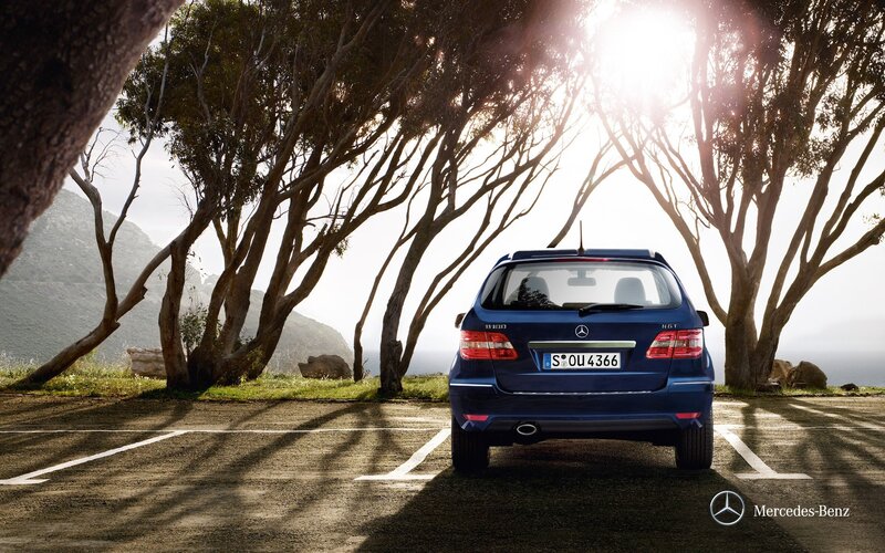 Blue Mercedes-Benz parked in sunlight