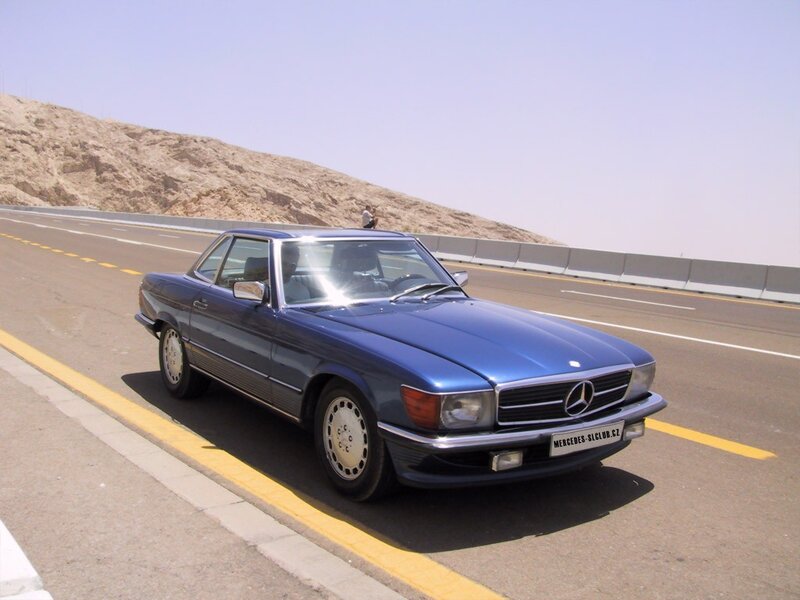 Blue Mercedes-Benz SL on a highway