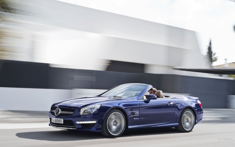 Blue Mercedes-Benz SL63 AMG driving