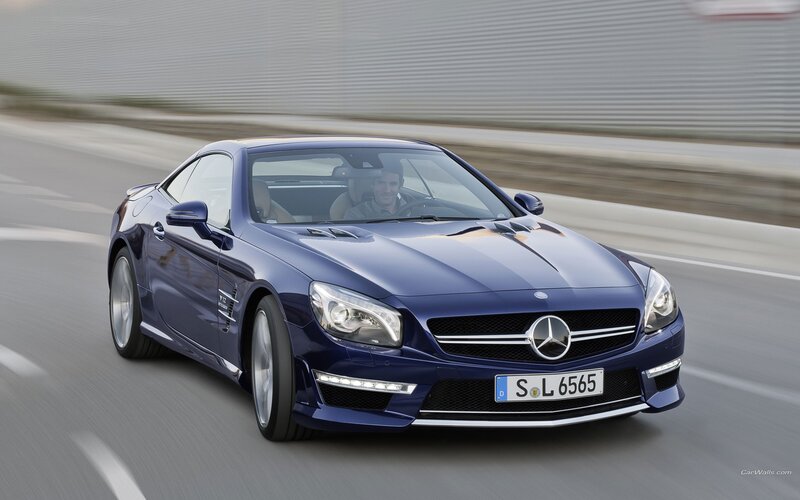 blue mercedes-benz sl63 amg in motion