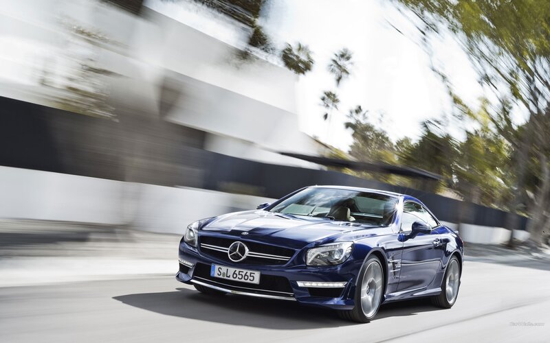blue mercedes-benz sl63 amg in motion