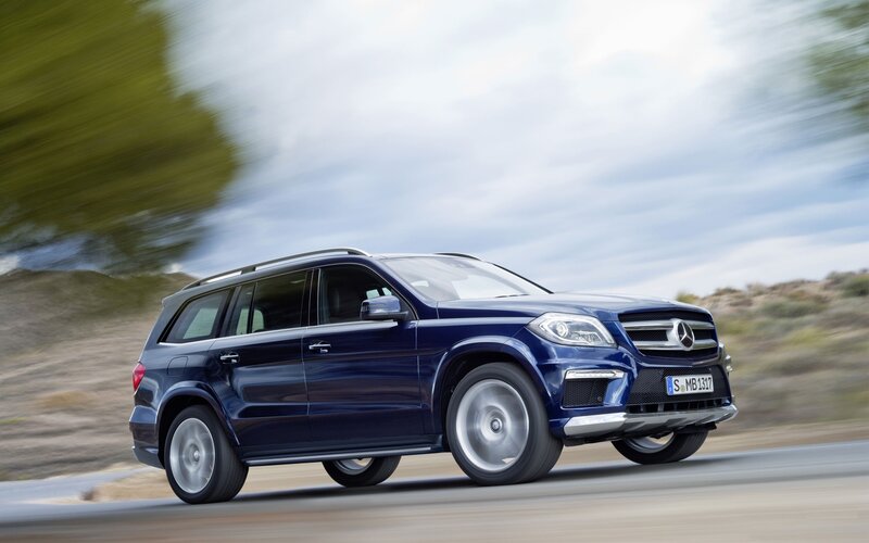 blue mercedes-benz suv in motion