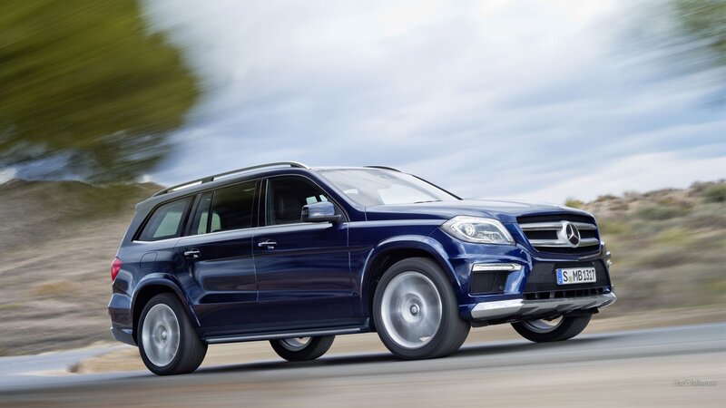 blue mercedes-benz suv in motion