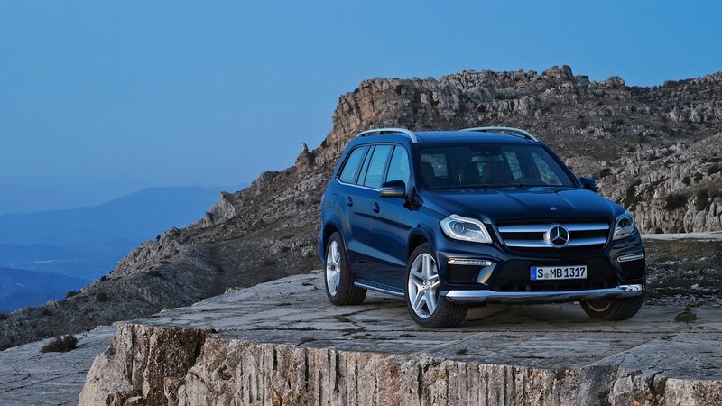 Blue Mercedes-Benz SUV on cliff