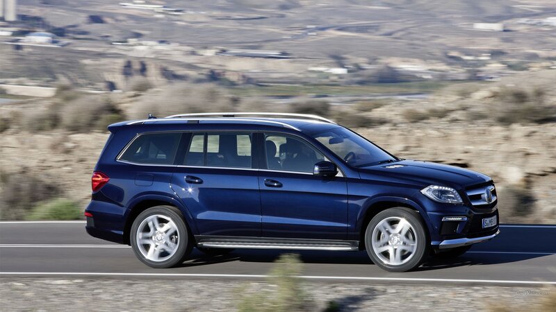 blue mercedes-benz suv on road