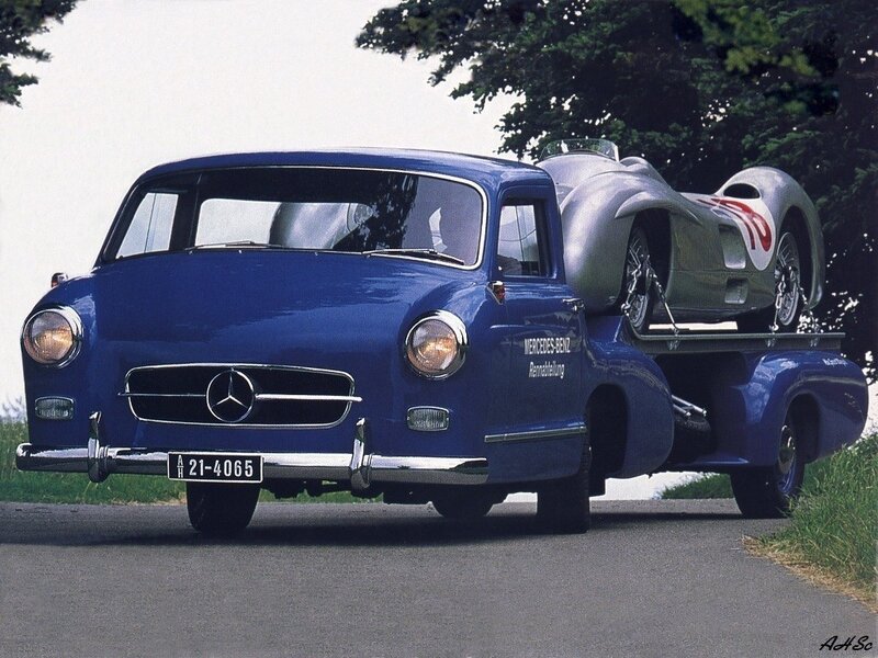Blue Mercedes-Benz truck with race car