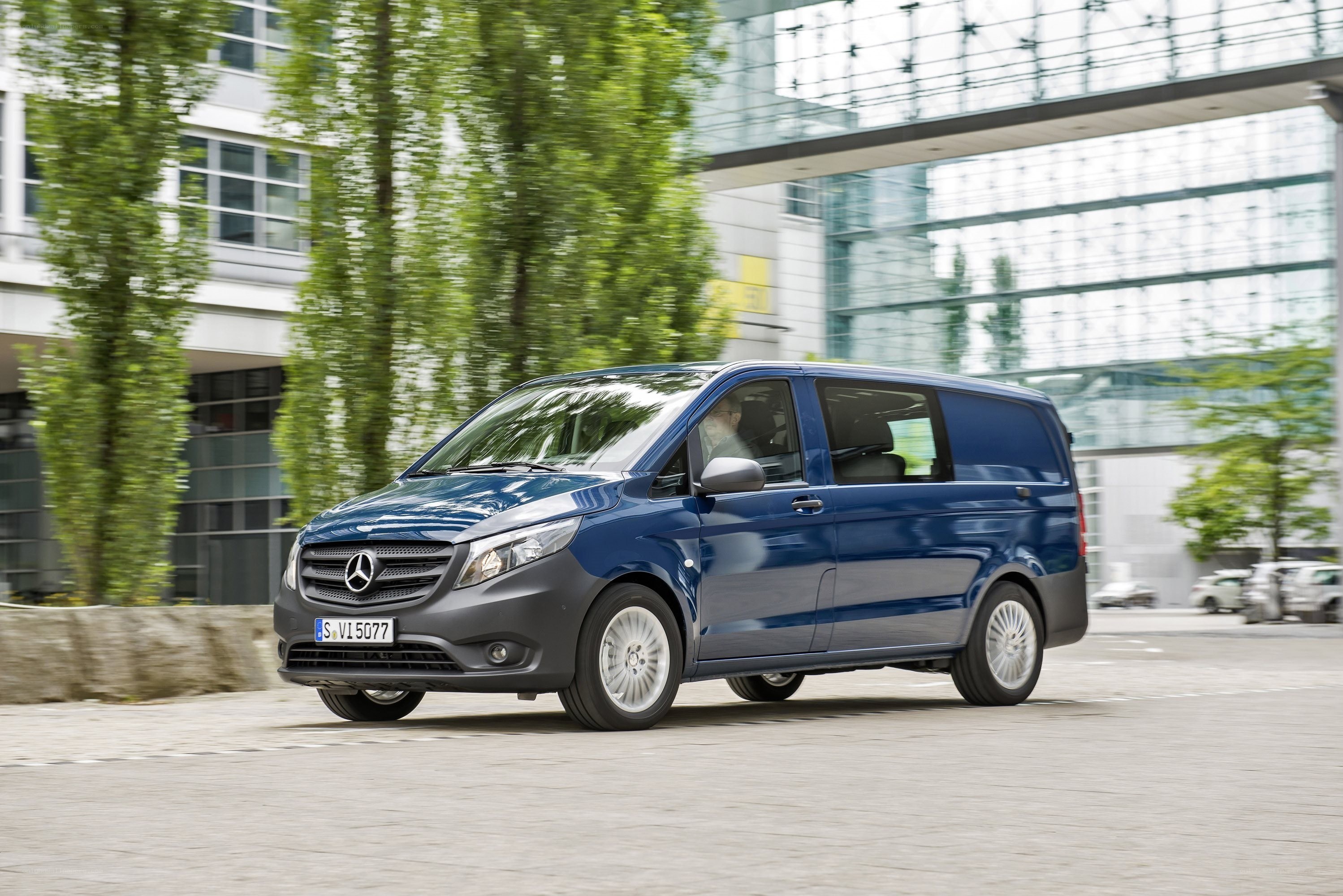 Blue Mercedes-Benz van in city