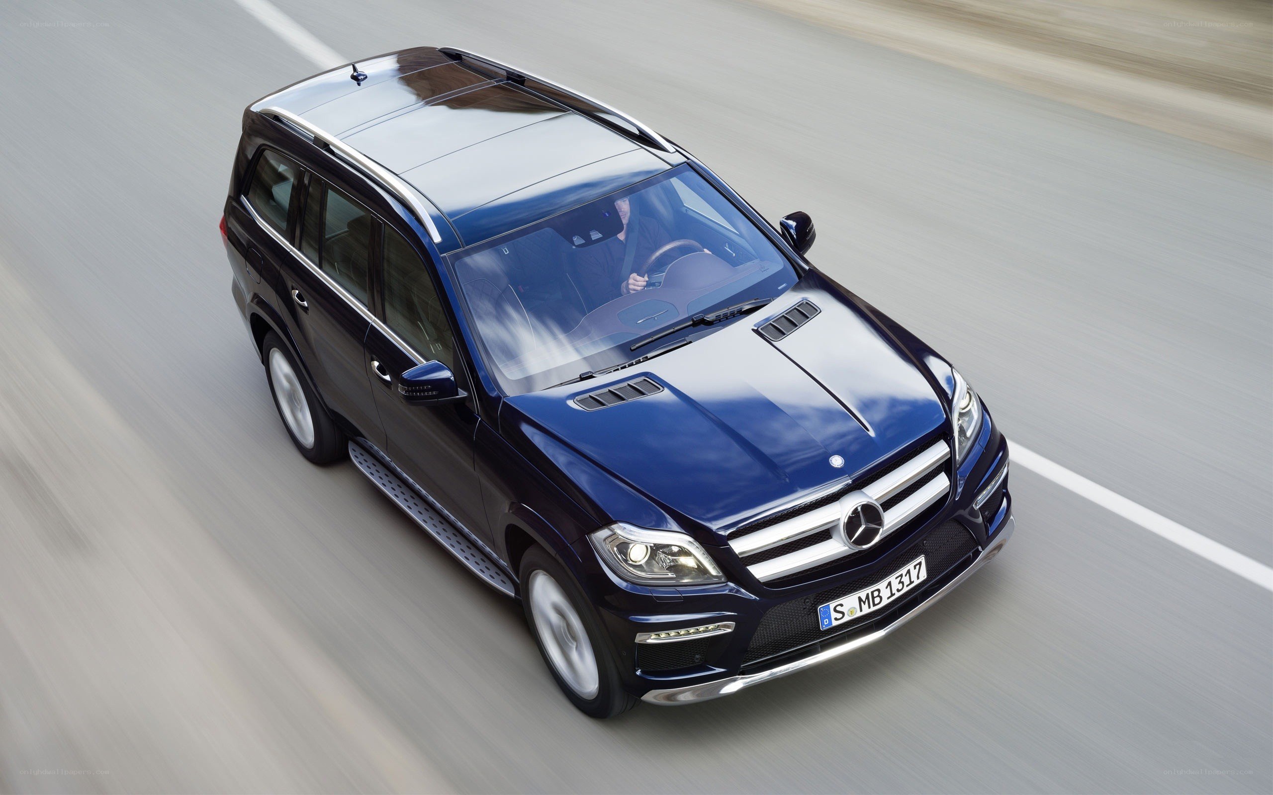 blue mercedes suv driving