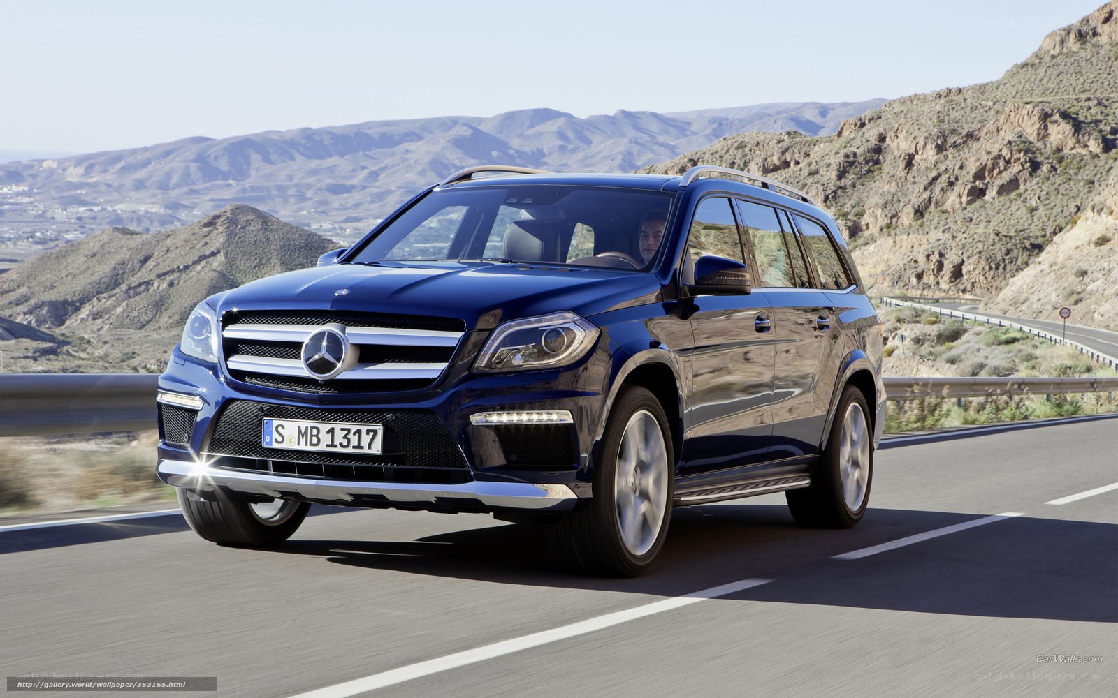 blue mercedes suv on mountain road