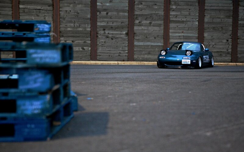 Blue Miata on asphalt