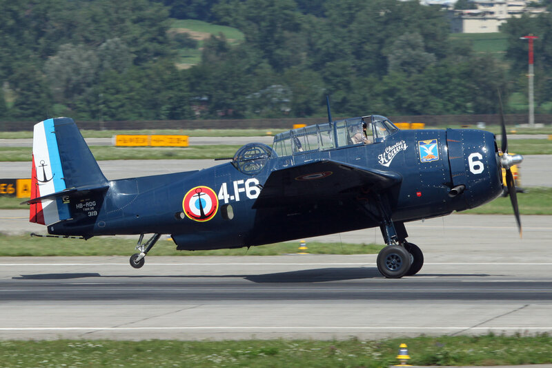 Blue Military Aircraft — Calm, Afternoon, Photograph