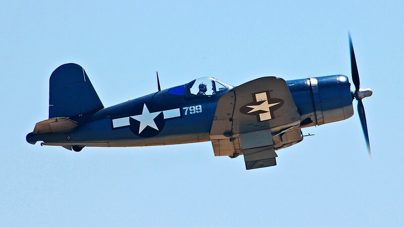 Blue Military Airplane — Calm, Afternoon, Photograph, Propeller, Pilot