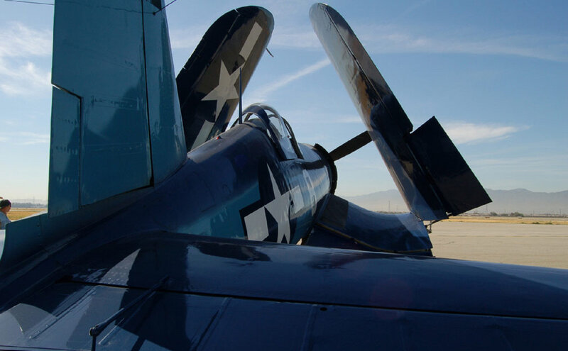 Blue Military Airplane — Calm, Afternoon, Photograph, Propeller