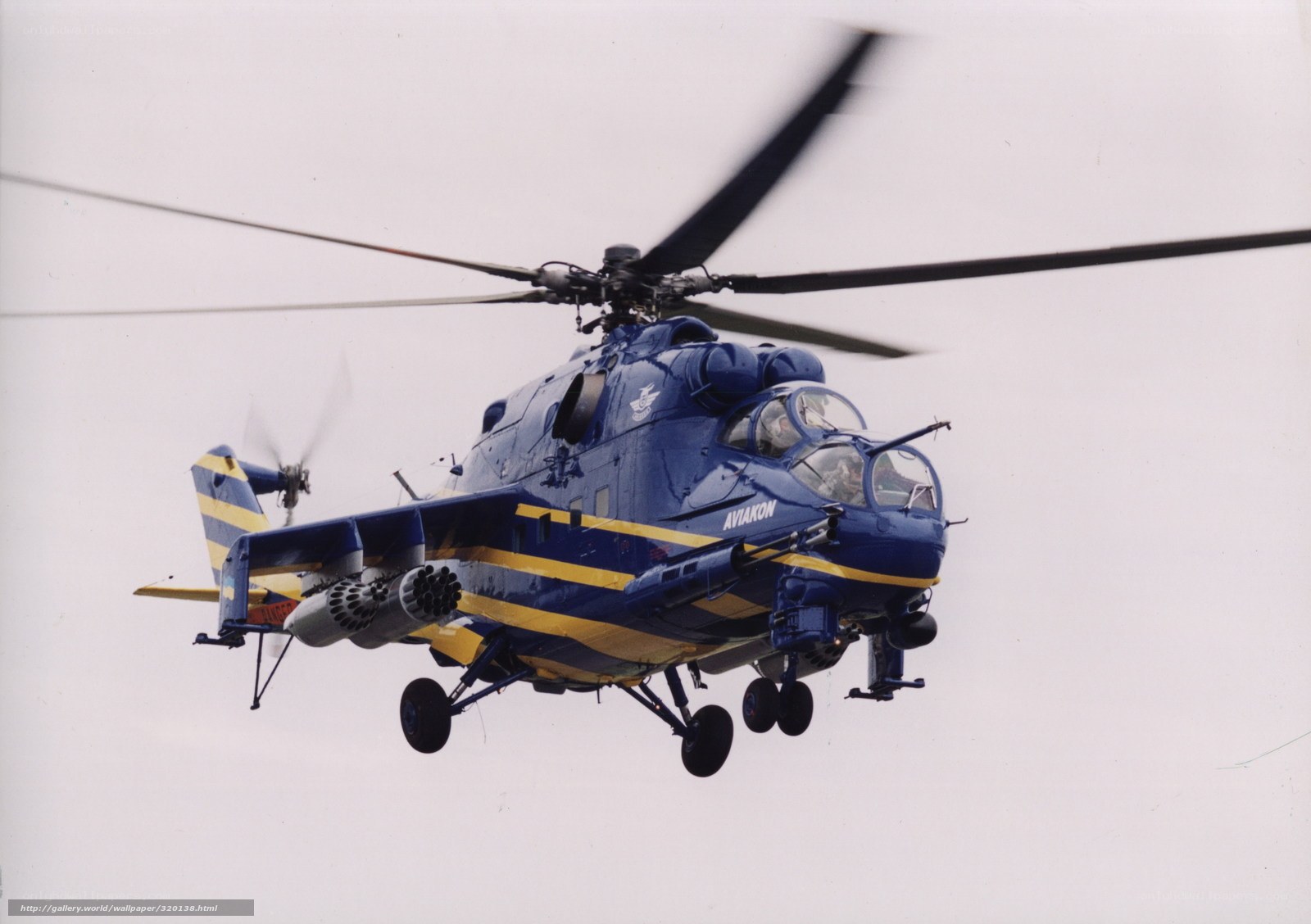 Blue military helicopter in flight