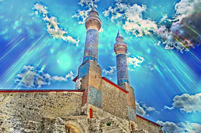Blue minarets under radiant sky