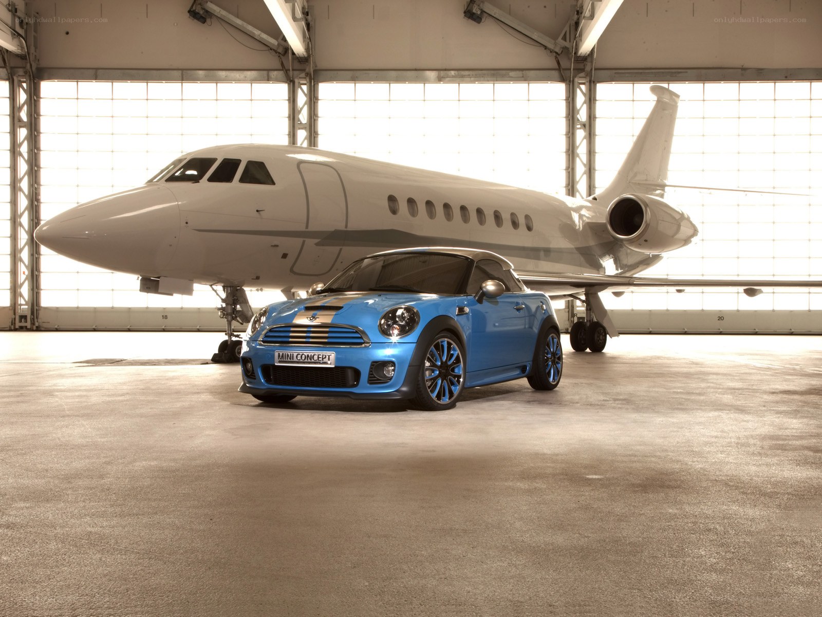 Blue Mini Concept car in hangar