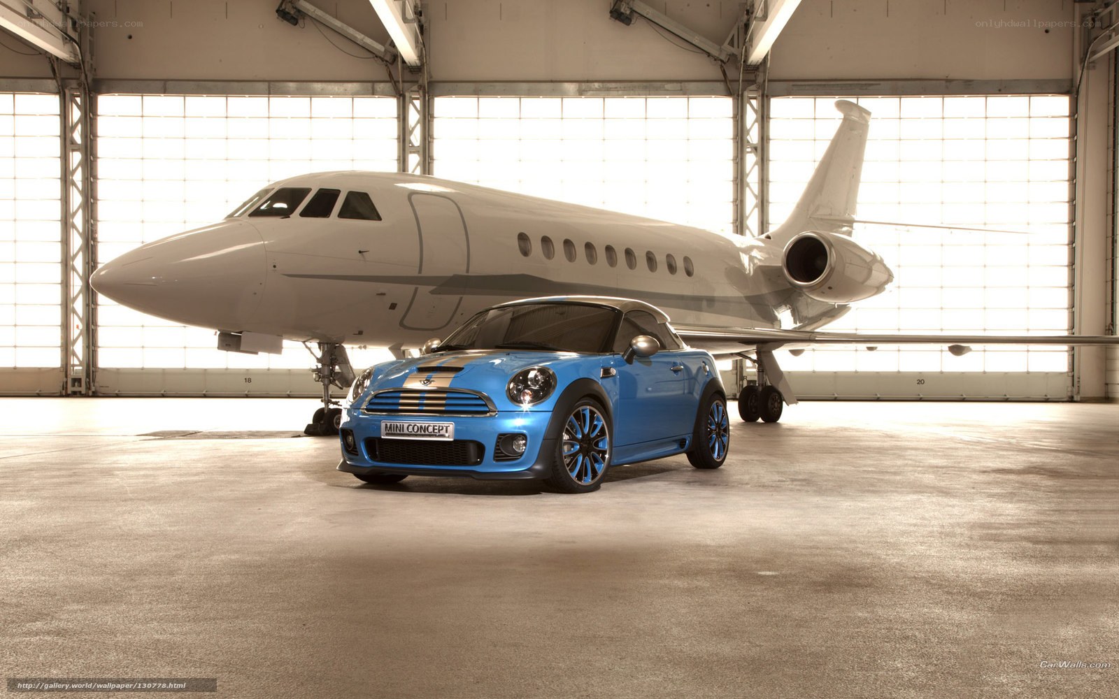 Blue Mini Concept car in hangar