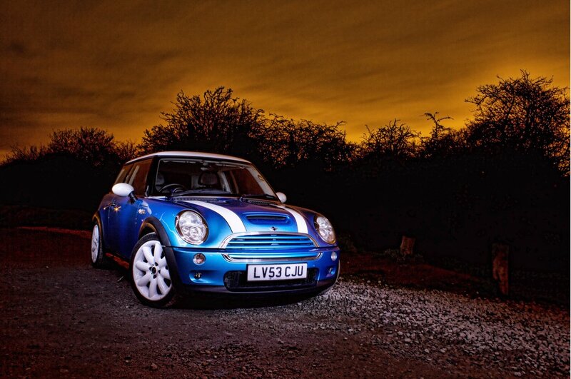 Blue Mini Cooper at dusk