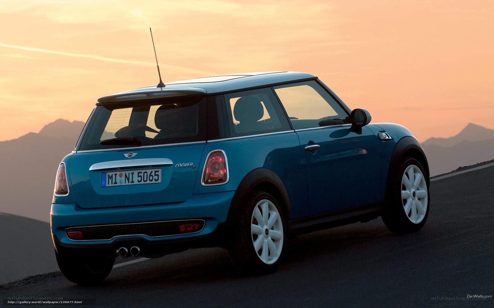 blue mini cooper at sunset