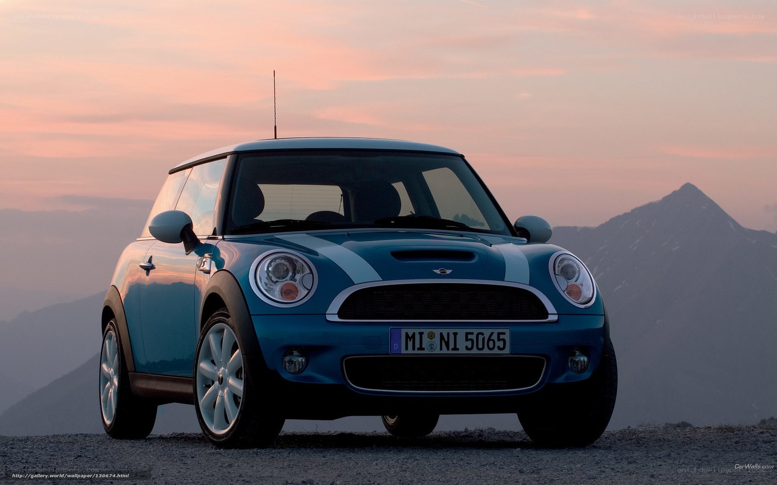 Blue Mini Cooper at sunset