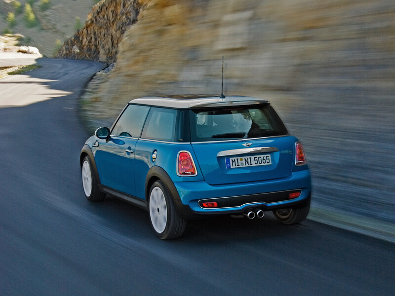 blue mini cooper driving on road