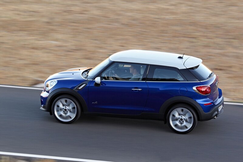 blue mini cooper driving on road