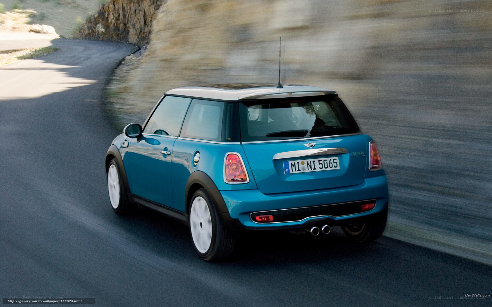 blue mini cooper driving on road
