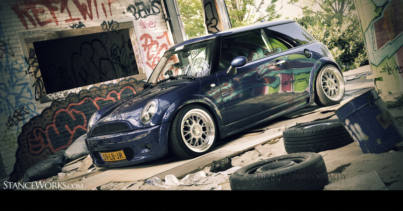 Blue Mini Cooper in graffiti alley