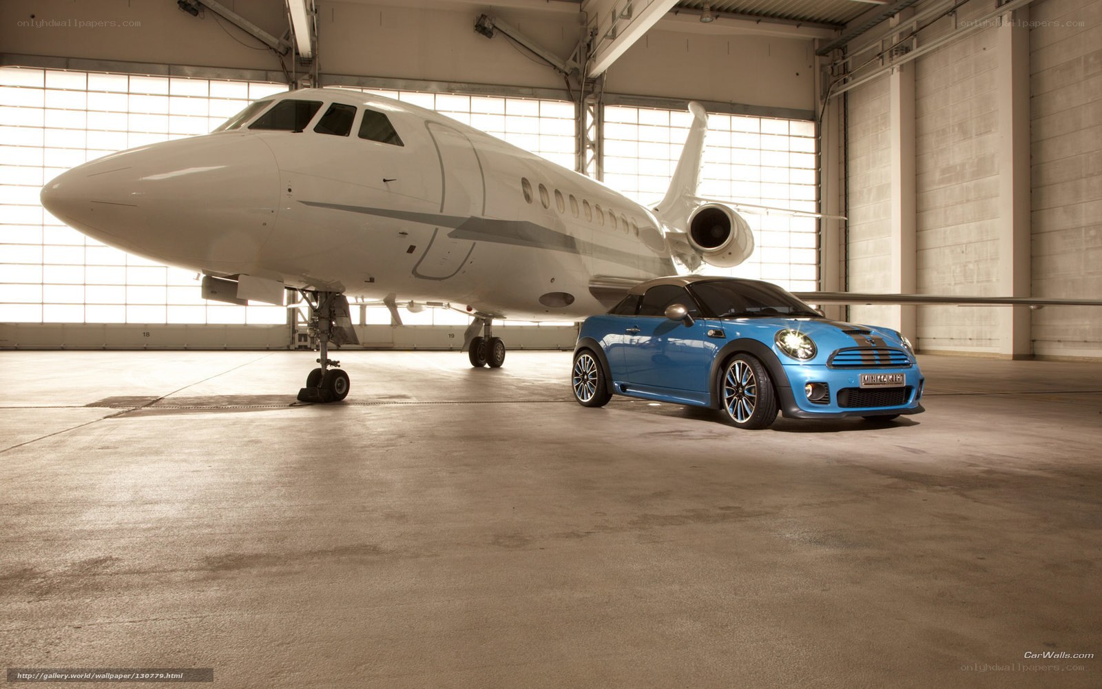 Blue Mini Cooper in hangar