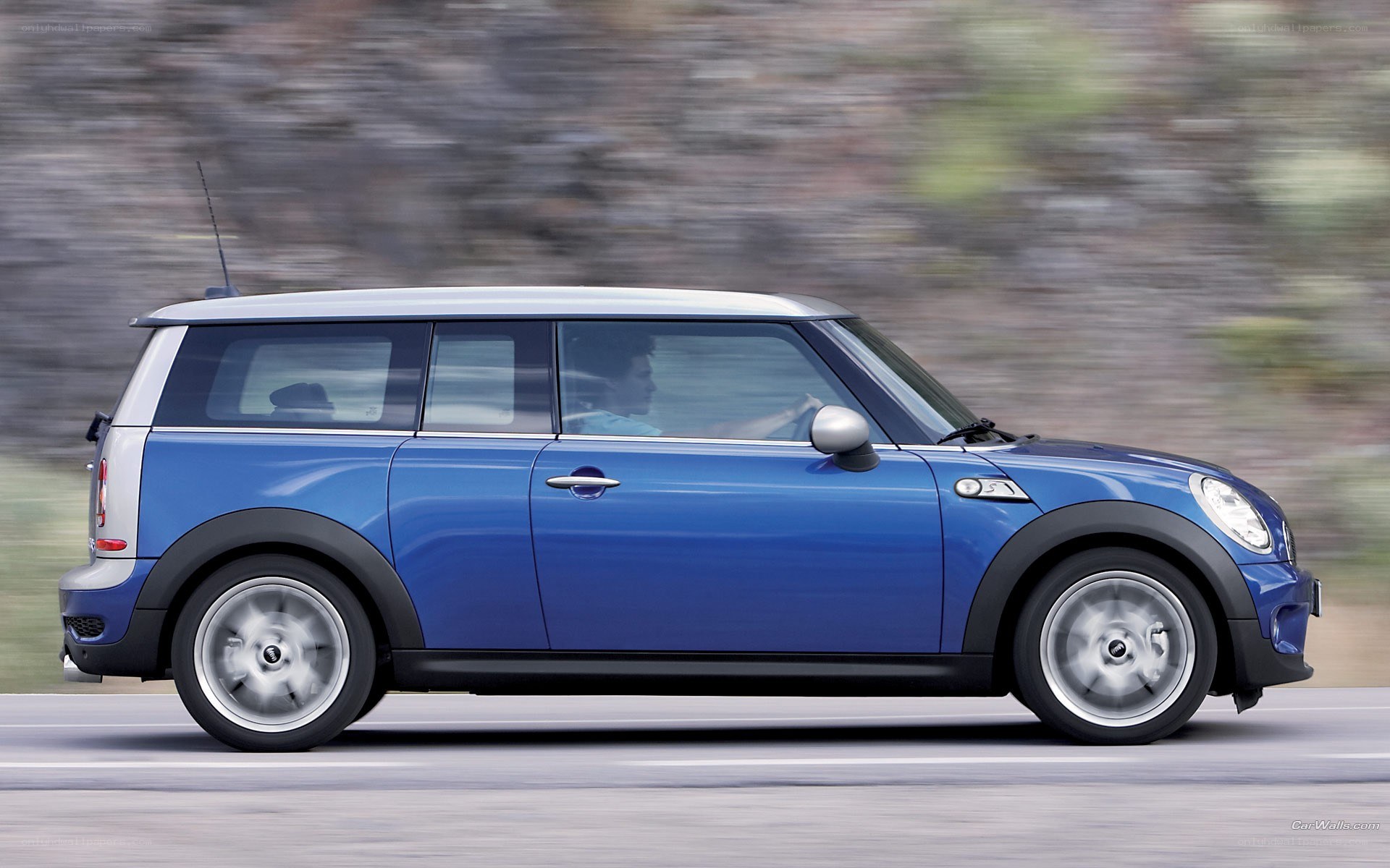 blue mini cooper in motion