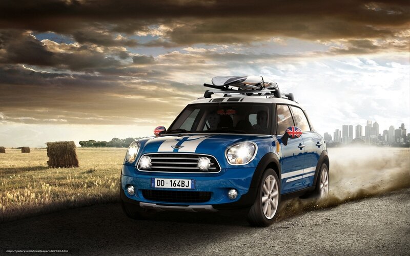 Blue Mini Cooper on a country road