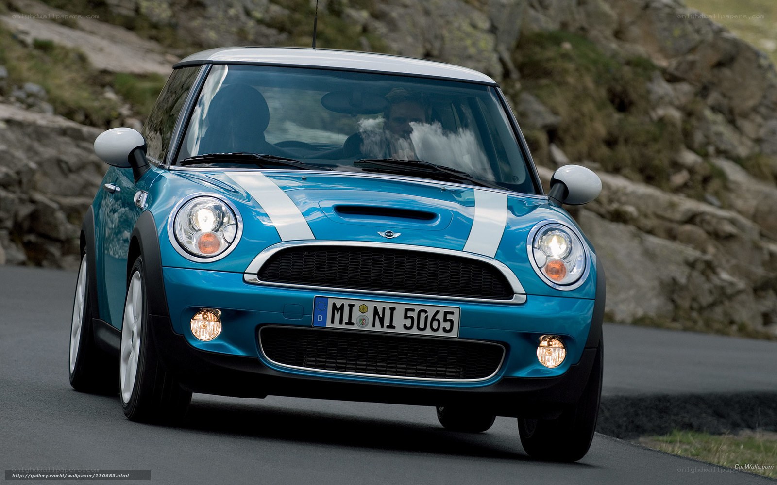 blue mini cooper on mountain road