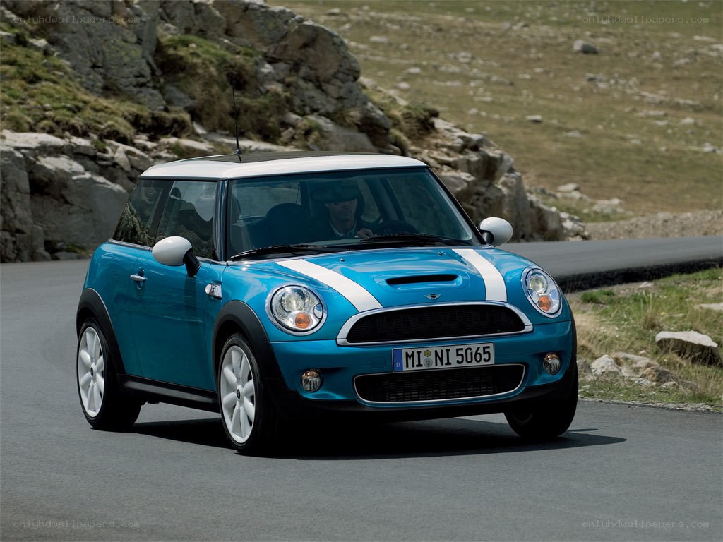 blue mini cooper on mountain road