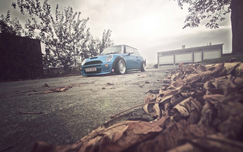 blue mini cooper on pavement