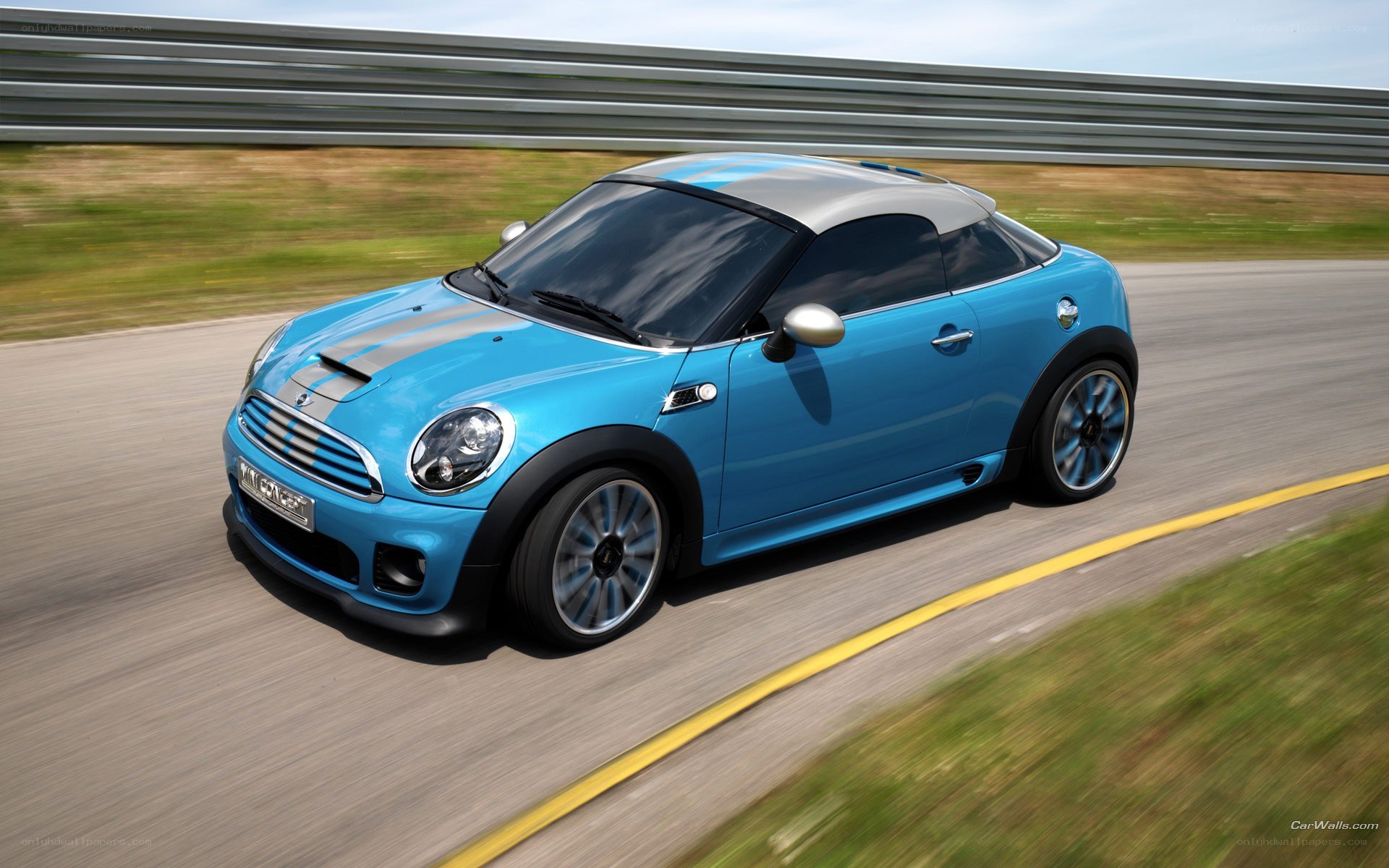 blue mini cooper on racetrack