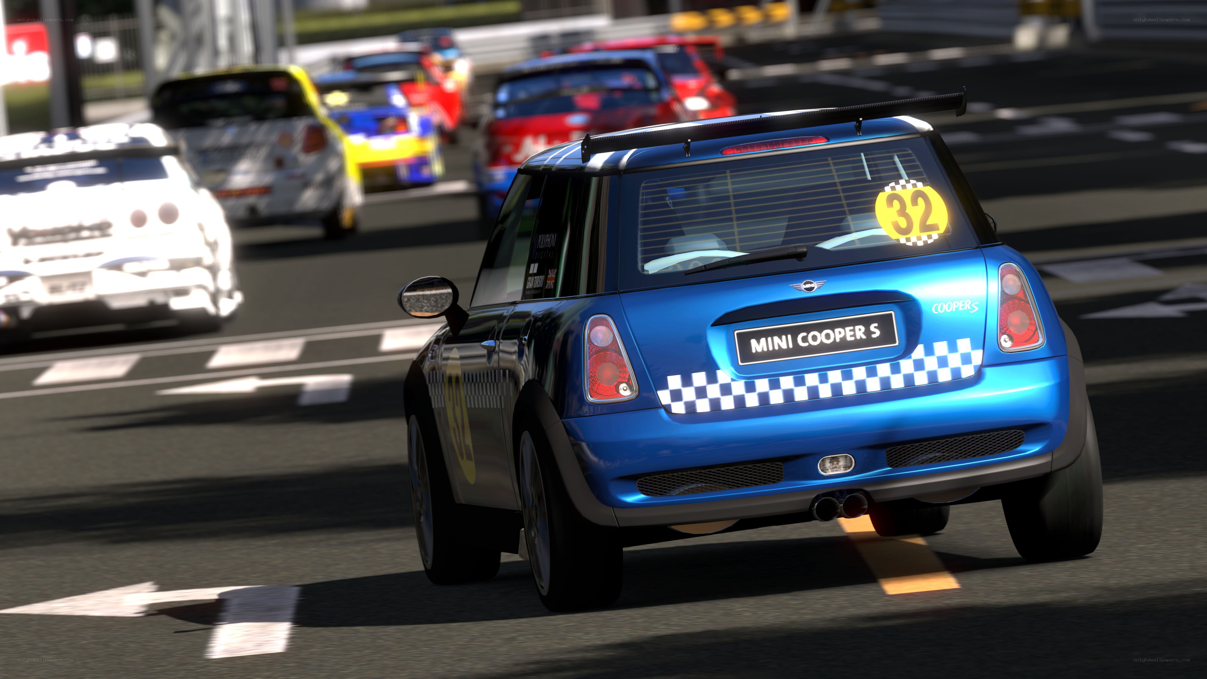 Blue Mini Cooper racing on track