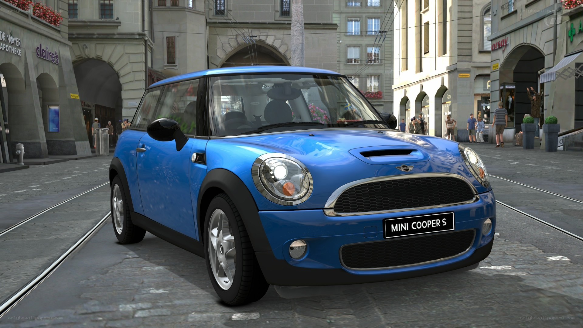 Blue Mini Cooper S on city street