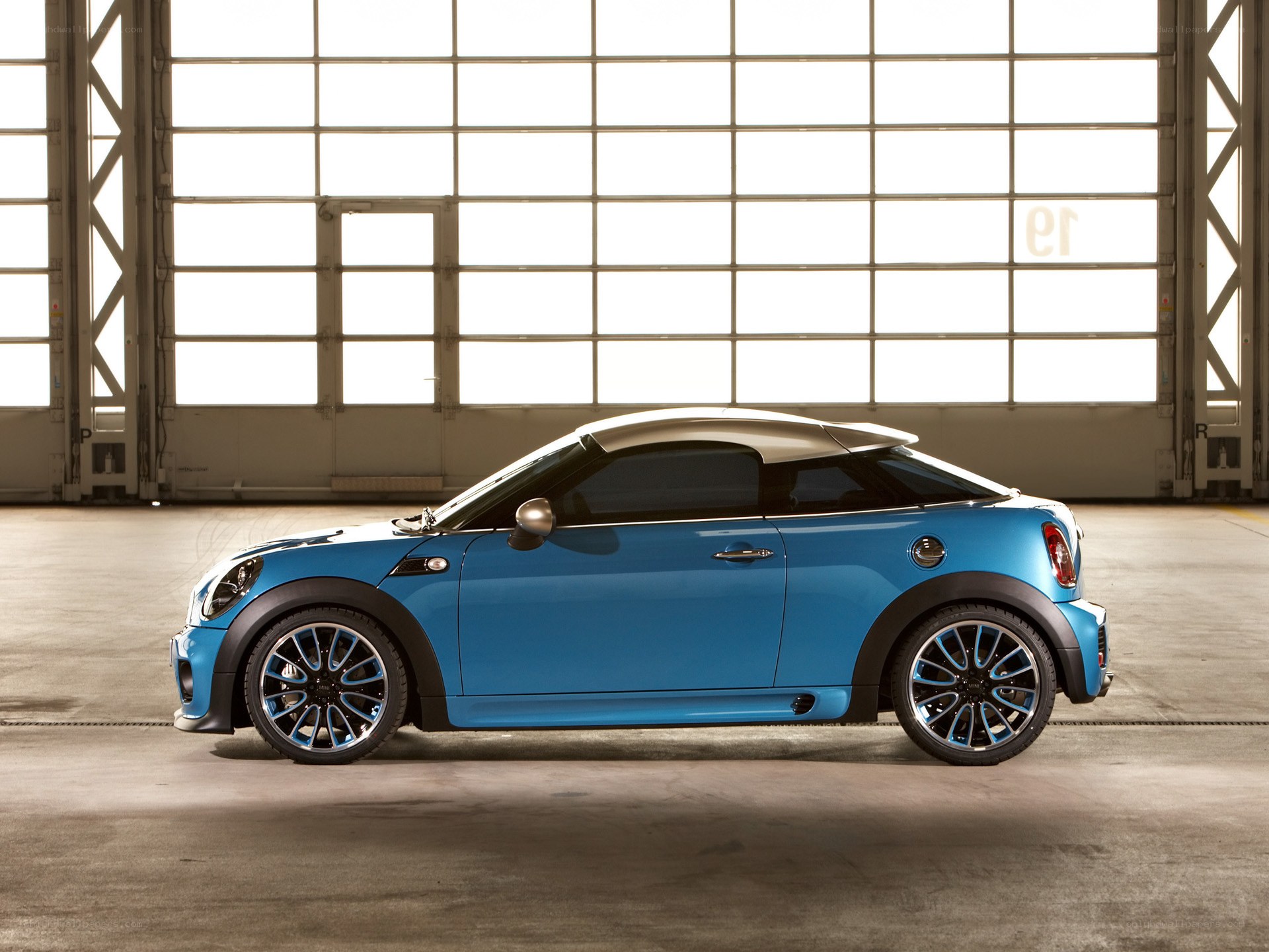 Blue MINI Coupe in a warehouse