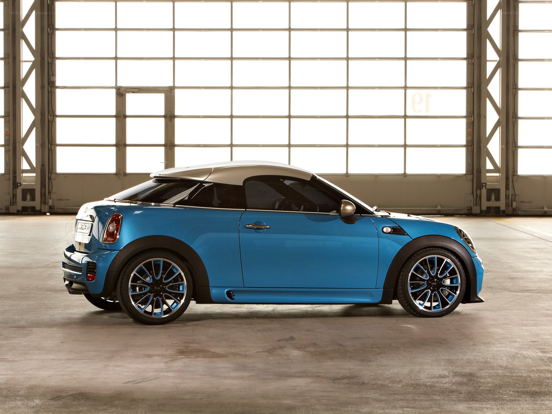 Blue MINI Coupe in a warehouse