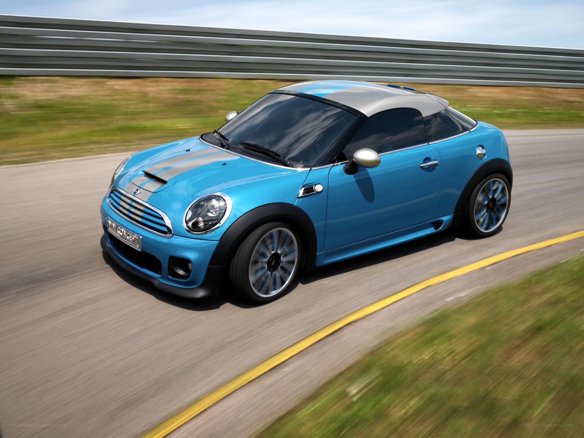Blue MINI Coupe on a racetrack