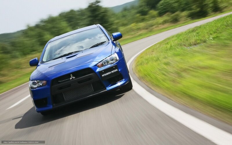 blue mitsubishi car on road