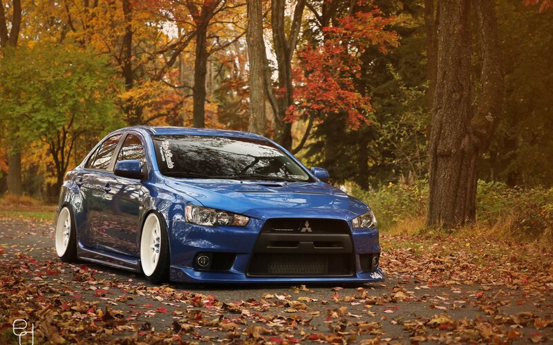 Blue Mitsubishi in autumn forest