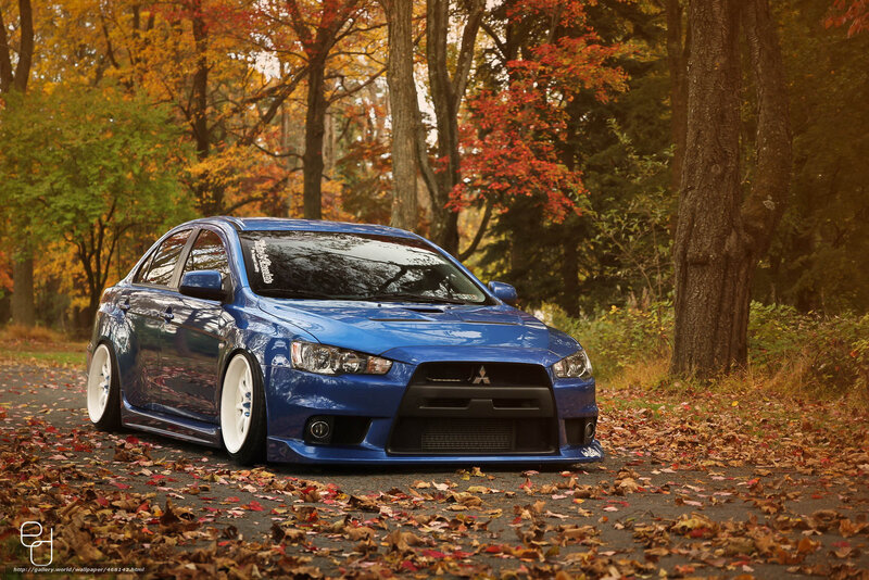 Blue Mitsubishi in autumn forest