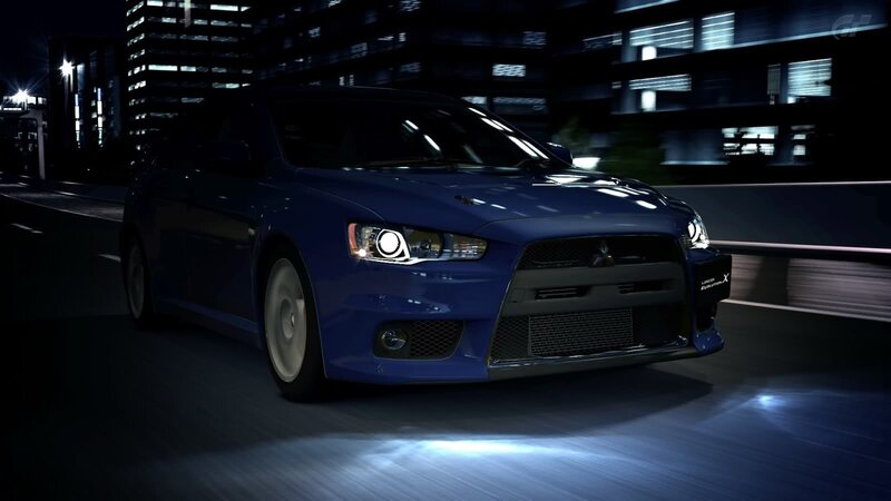 blue mitsubishi in city at night