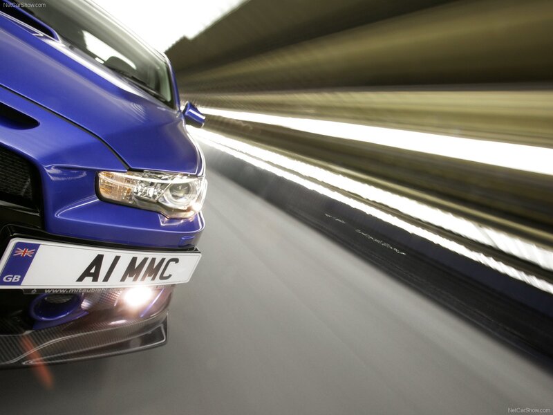 blue mitsubishi in motion